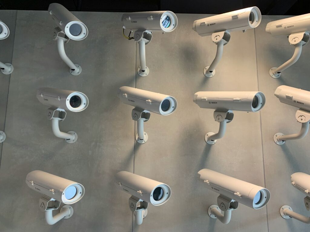 Security cameras mounted on a gray concrete wall