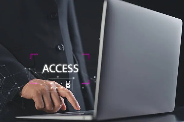 User accessing a commercial access control system on a laptop
